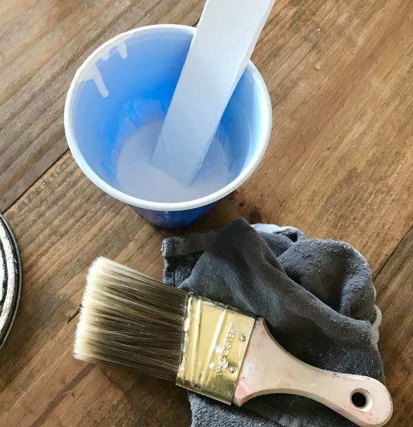 How to whitewash wood--white paint and paintbrush