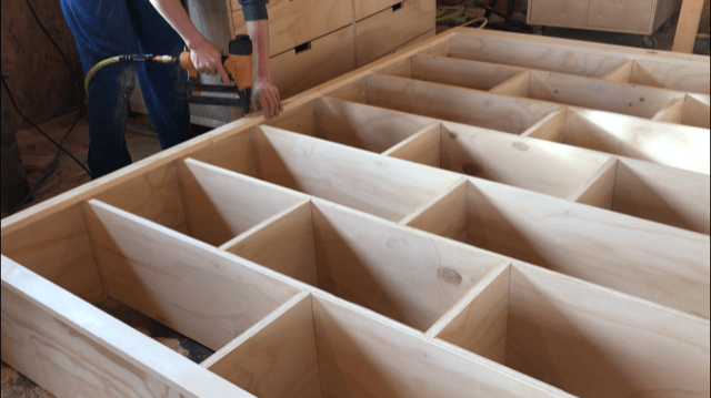 Nailing face frame onto DIY modern stand alone bookshelf