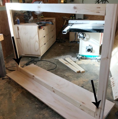 divider frame attached to bottom panel on workshop floor