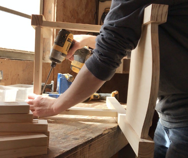 Shara Woodshop Diaries assembling frame for wooden kids chair on workbench