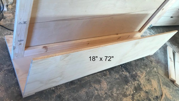 plywood panel installed onto workshop lumber storage cart 