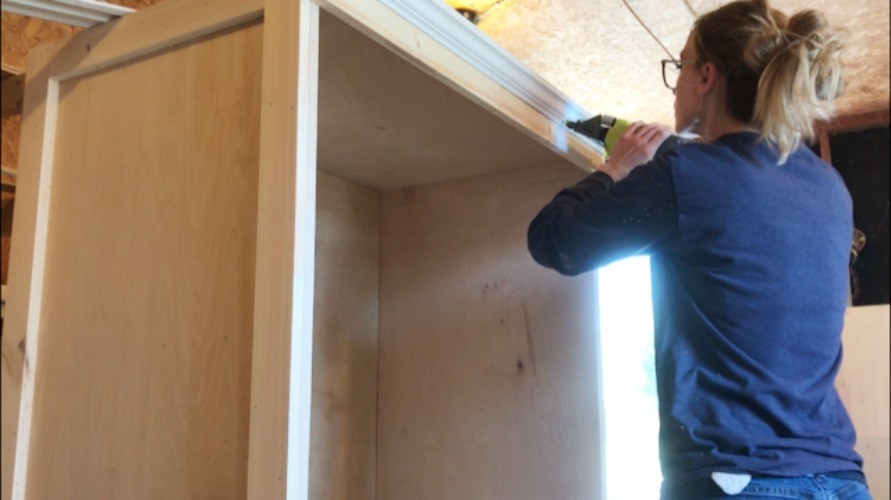 Shara Woodshop Diaries installing crown molding around top of armoire cabinet box