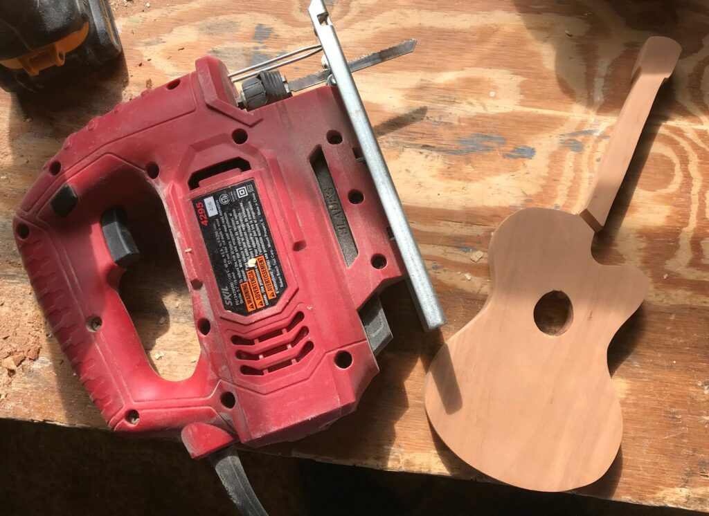 Cut scrap wood guitar in half