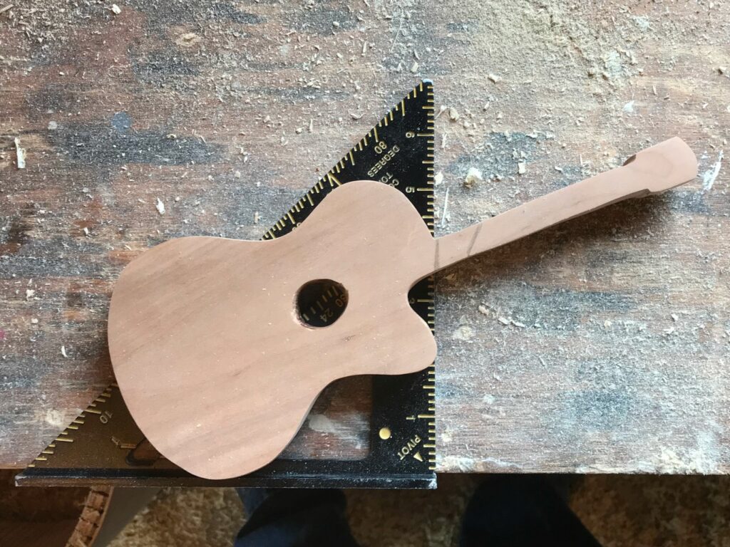 Mark where to cut guitar to make left and right bookends