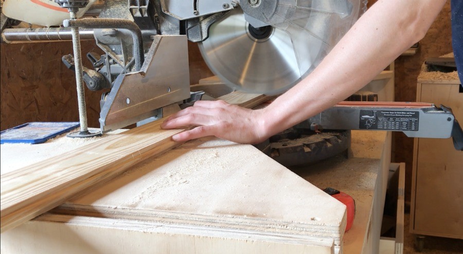 cut boards to glue up stove top cover top on miter saw