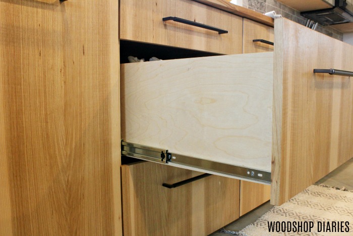 DIY kitchen cabinet with drawers open
