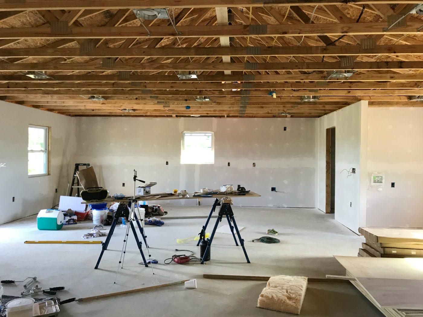 one room garage apartment drywall on walls and trusses open on ceiling