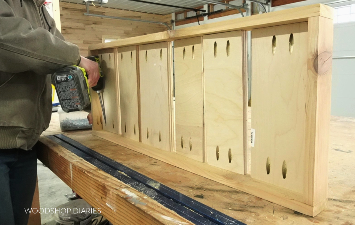 Shara Woodshop Diaries installing boot tray slats into frame with pocket holes and screws