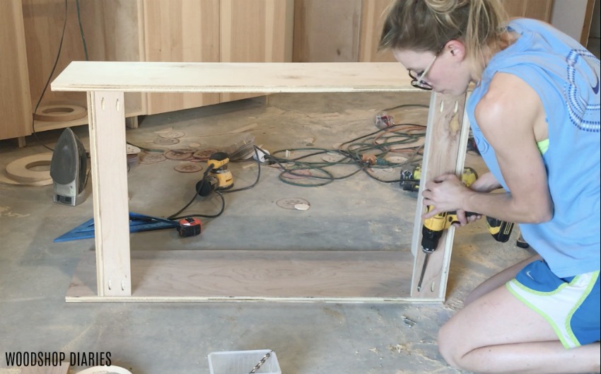 Shara Woodshop Diaries installing back supports onto upper kitchen cabinets