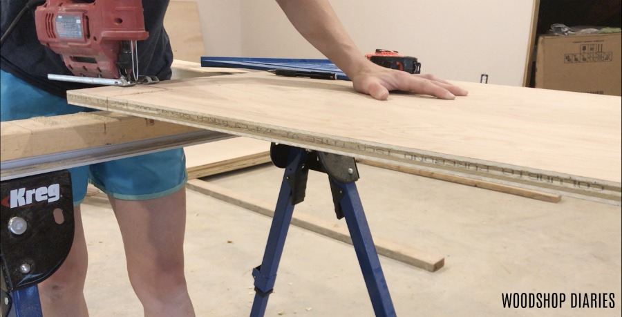 Shara cutting out cabinet toe kicks with jig saw