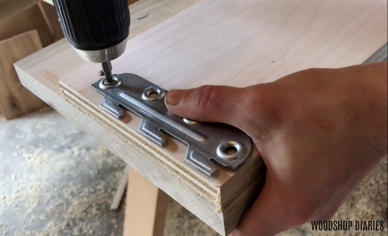 Install teeth part of bracket into modern bed rails