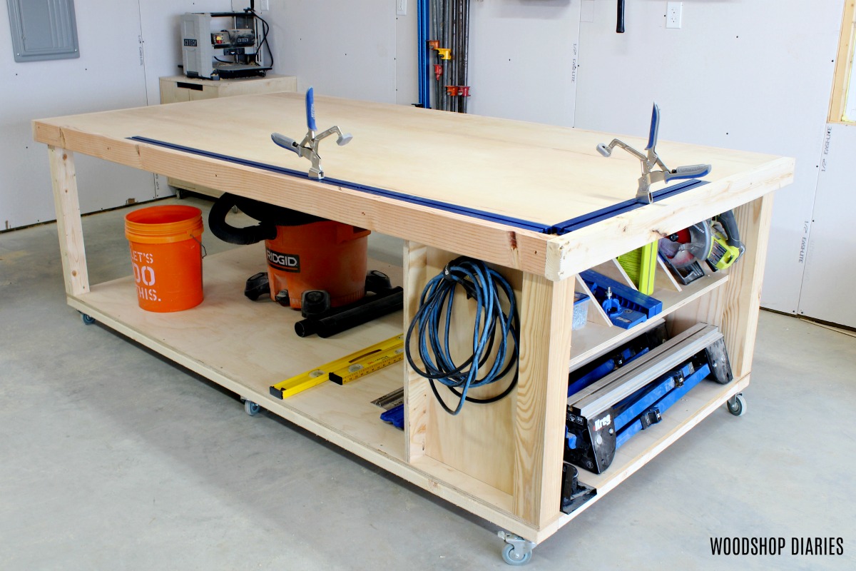 Finished DIY plywood top mobile workbench with clamp tracks installed