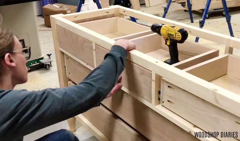 Test fitting drawer fronts on middle top drawer of dresser