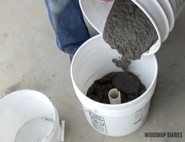 Pour concrete into concrete planter mold bucket