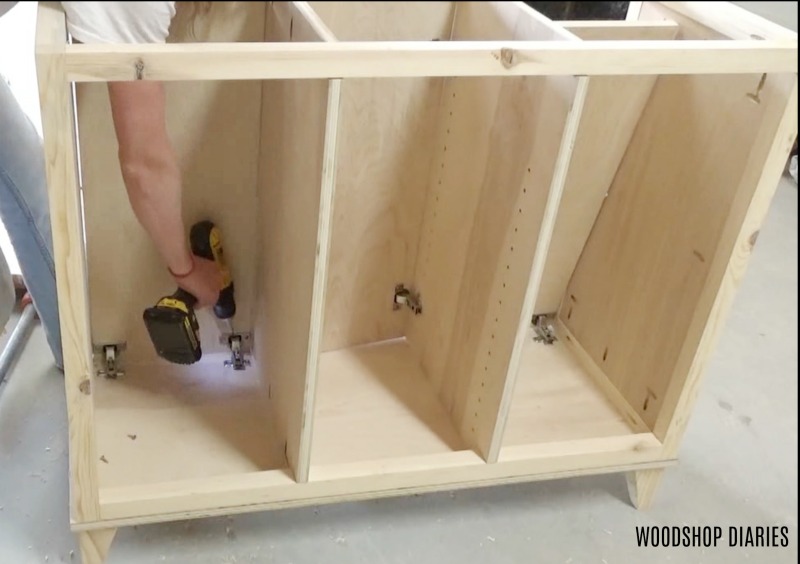 Shara installing doors into tilt out hamper cabinet