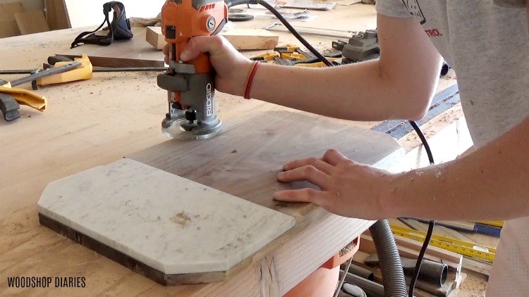 Using a trim router to chamfer the edge of a walnut serving platter