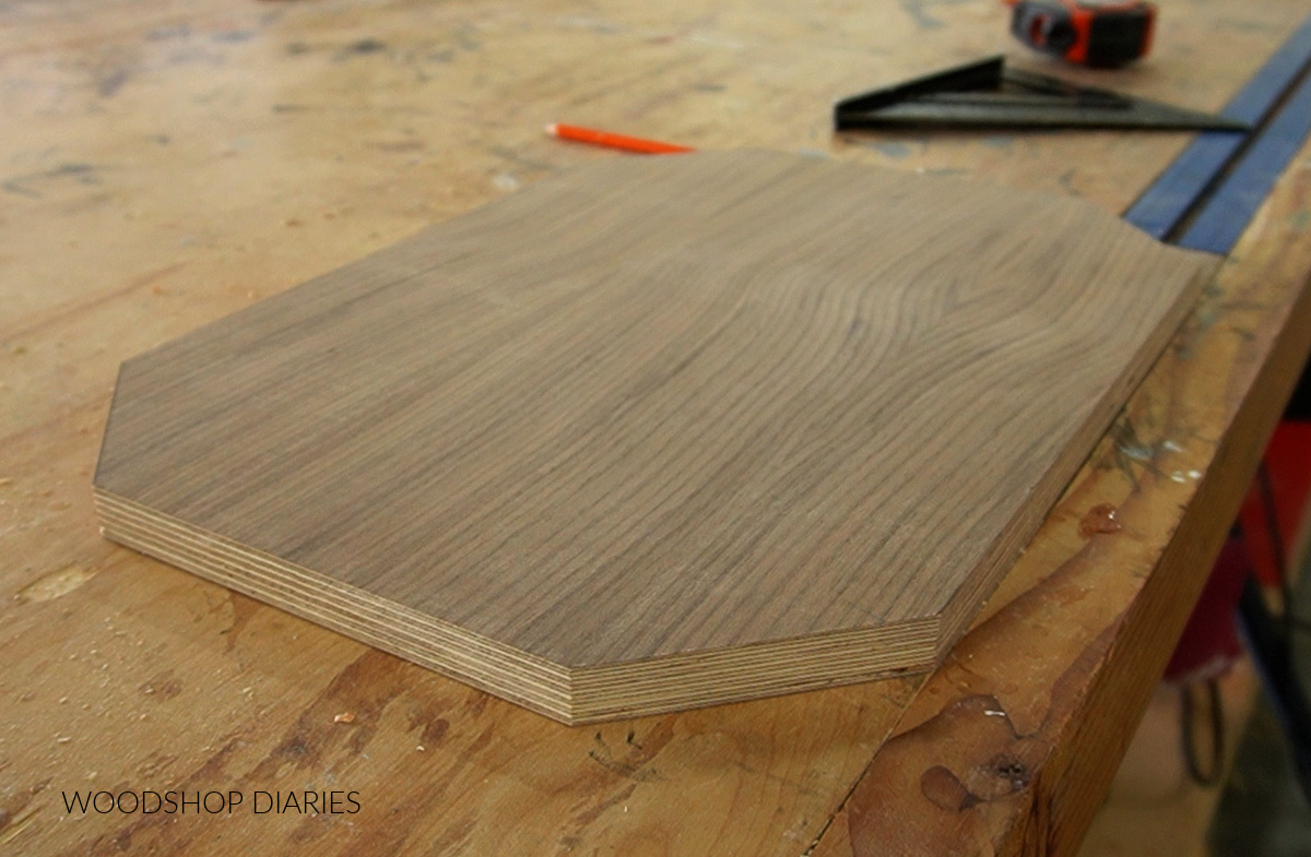 Plywood panel for serving tray cut and sitting on workbench