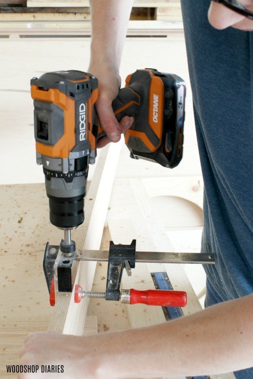 Using hammer drill to drill dowel holes in project