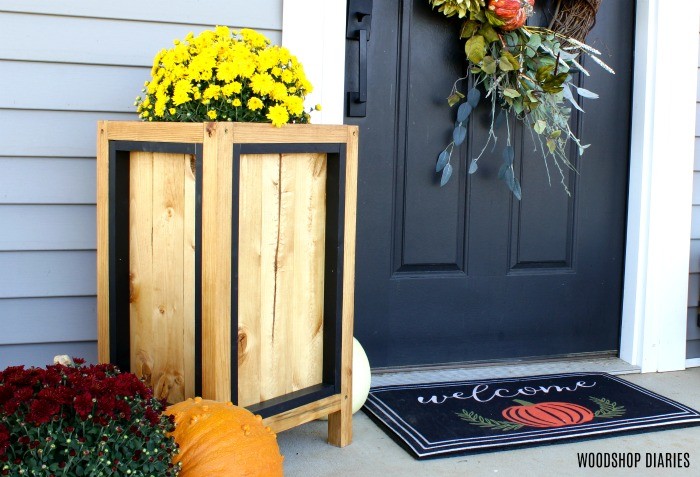 Fall project idea #5: a simple wood and black planter box with a mum by the front door