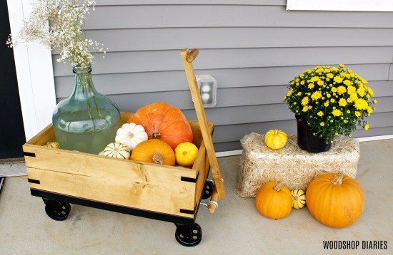 DIY Wooden Wagon on front porch with pumpkins and mums