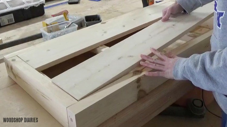 place wood slats into hope chest lid frame