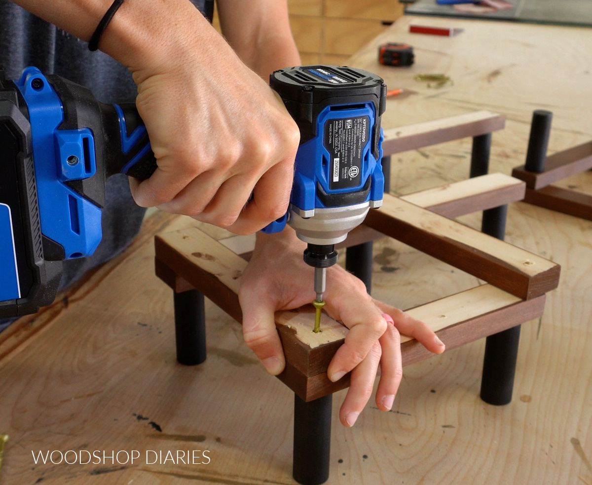 Close up of Shara Woodshop Diaries driving screw to assemble accordion hat rack
