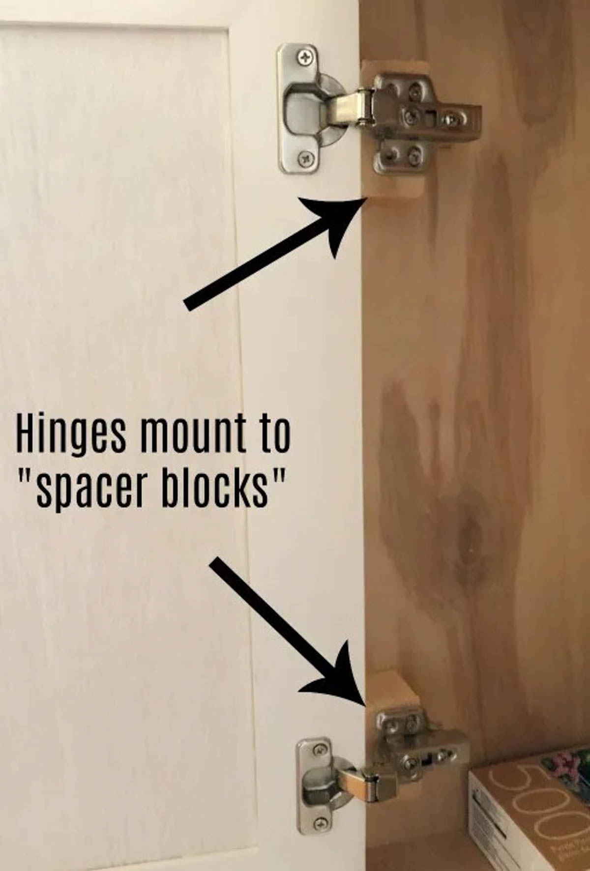 Attach doors onto spacer blocks in entertainment center cabinets