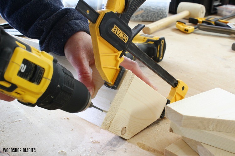 Predrill holes to drive screws into DIY pipe clamp rack