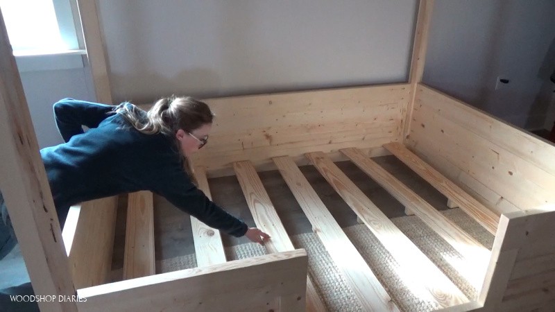 Install bed slats into kids house bed