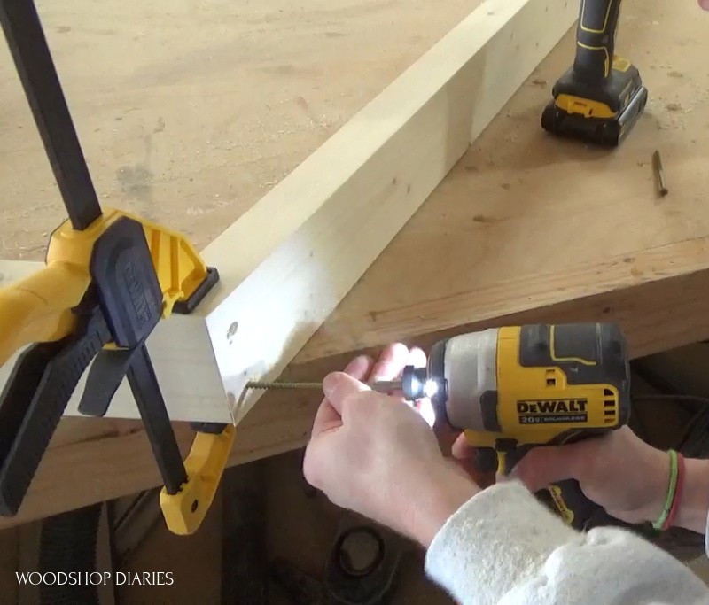 Attaching roof peak of house bed frame