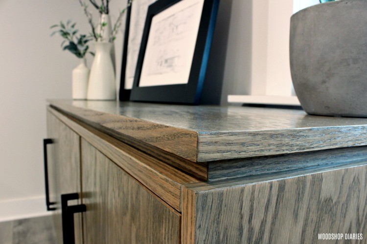 Close up of red oak plywood used in a console cabinet build with red oak edge banding at corner