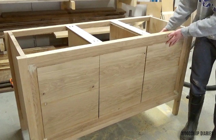 Three sections of front panel laid out on dresser console vanity piece