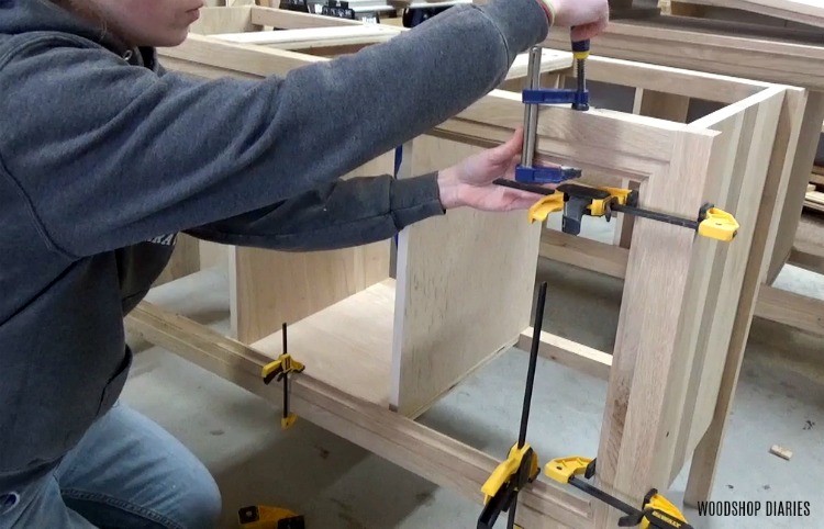 Glue and clamp trim detail along front of dresser vanity