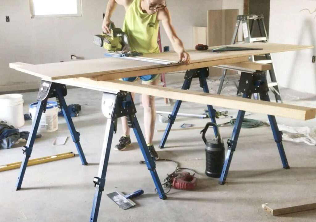 Plywood set on saw horses for easy cutting with circular saw
