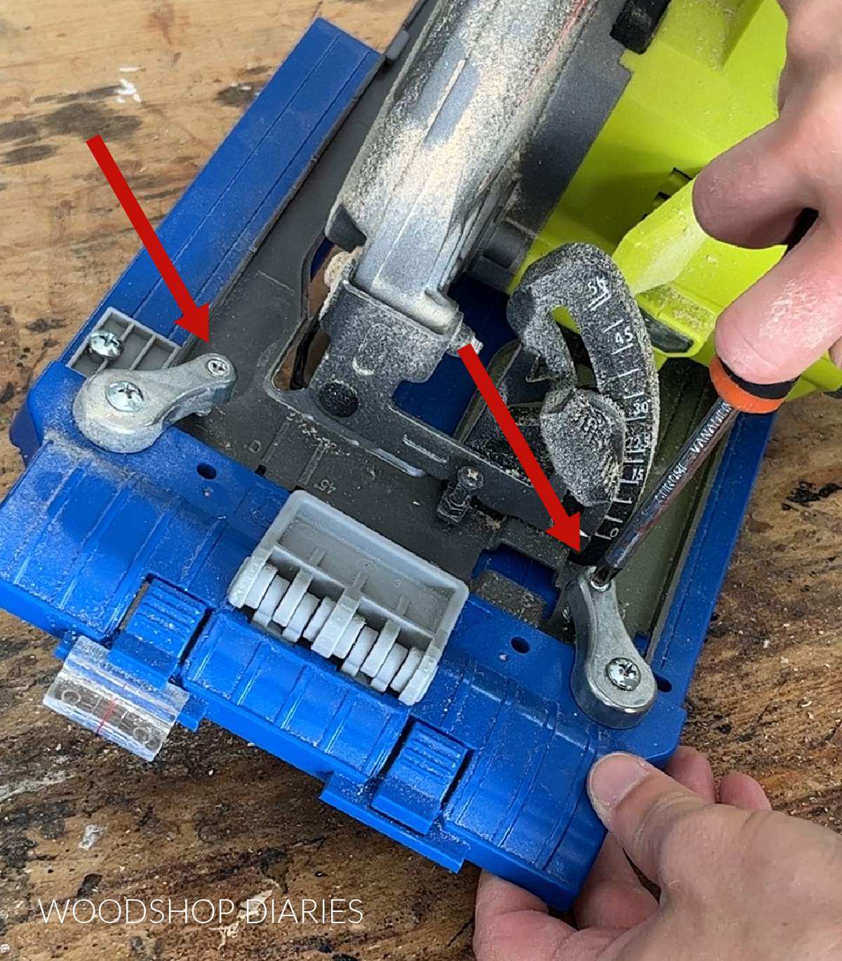 Close up using screwdriver to secure Kreg Rip Cut sled to base plate