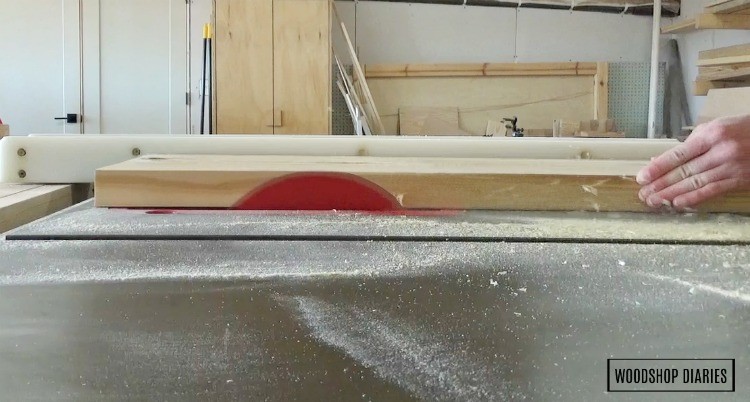 running 2x10 top shelf pieces through table saw to clean up and square off edges