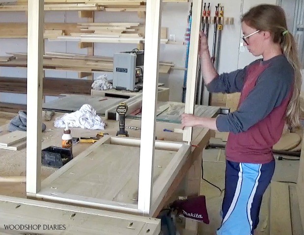 Shara Placing dresser frame supports onto side panel--using dowels and wood glue to assemble