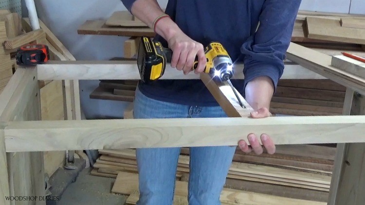 Shara installing 2x2 top frame block to add drawer divider into dresser frame