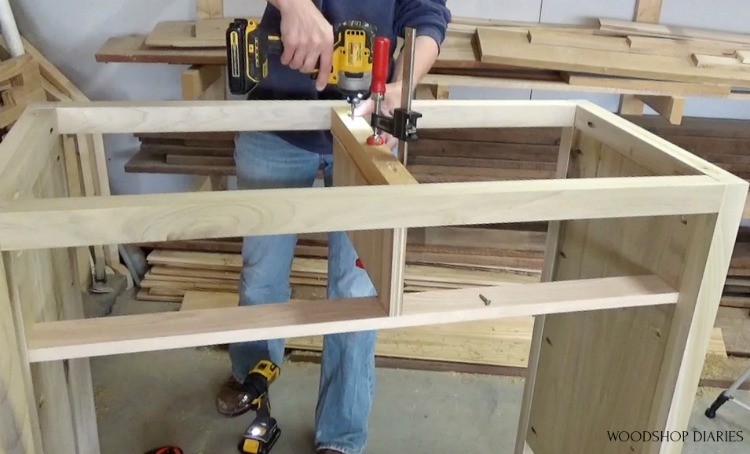 Screwing middle dresser drawer divider into place