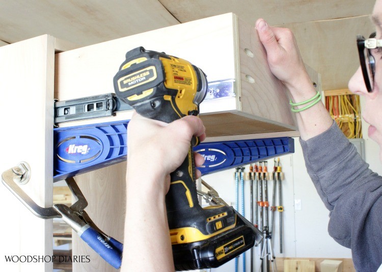 Screw drawer slides into drawer slide box sitting on drawer slide jig