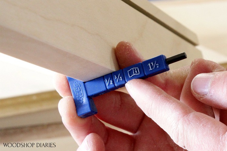 Close up measuring board thickness with Kreg pocket hole jig measuring tool