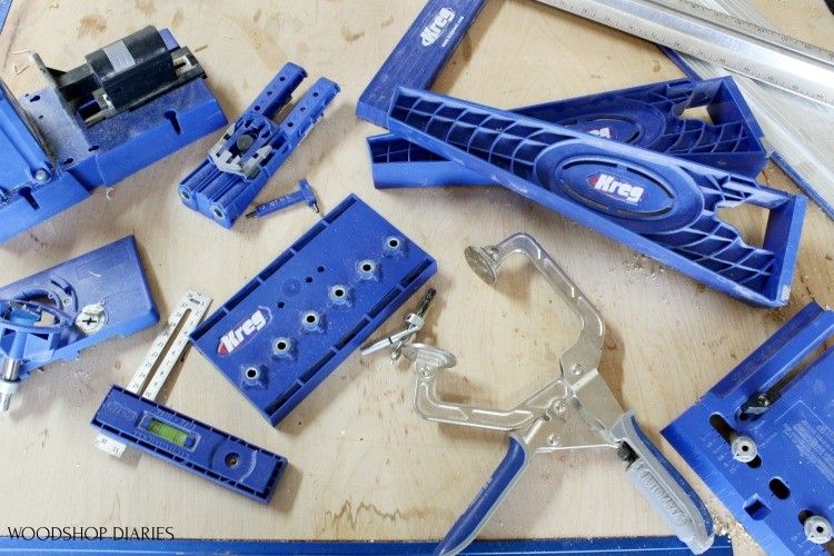 Kreg Tool Jigs laid out on workbench--these are the tools needed to build cabinets