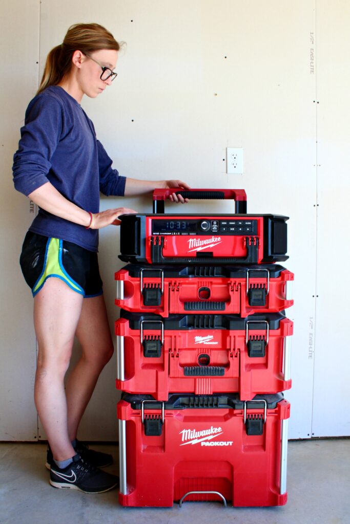 Shara Woodshop Diaires standing next to Milwaukee PACKOUT system