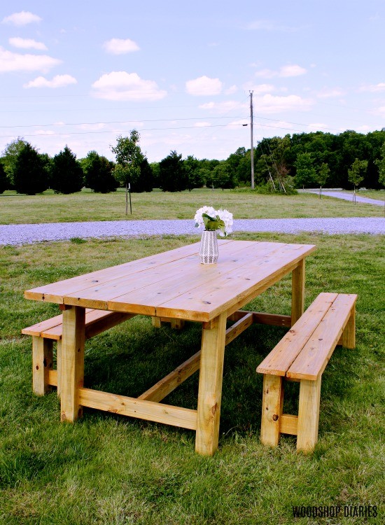 Trestle table and matching benches staged out in front yard