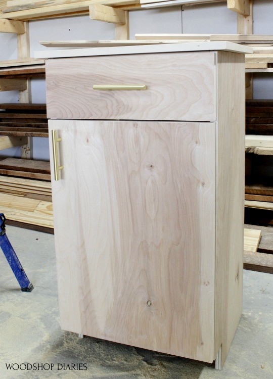 Finished cabinet with door and drawer hardware installed