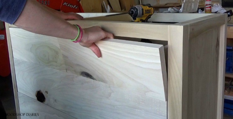 Test fitting top drawer fronts in place in dresser frame