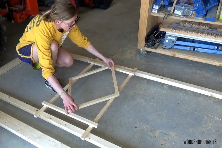 Shara designing diamond shape for center of trellis on garden bed