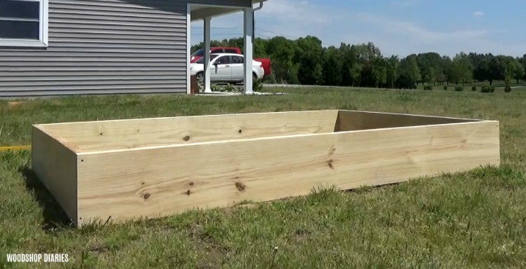 Simple garden bed box assembled in yard