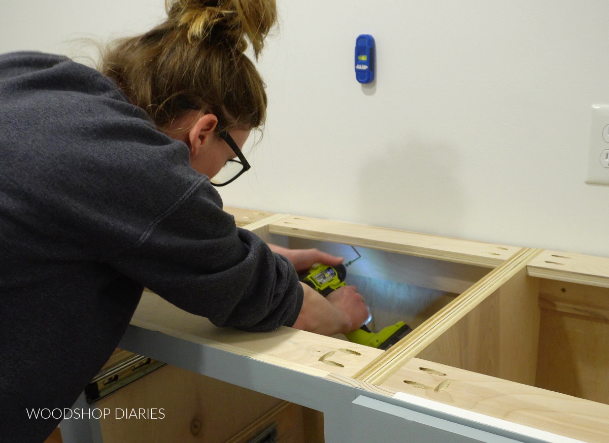 Using magnetic stud finder to install cabinet box