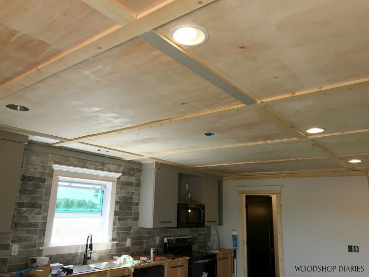 Trim installed on ceiling seams in kitchen